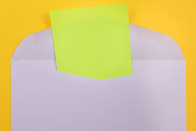 Close-up of colored pencils over white background