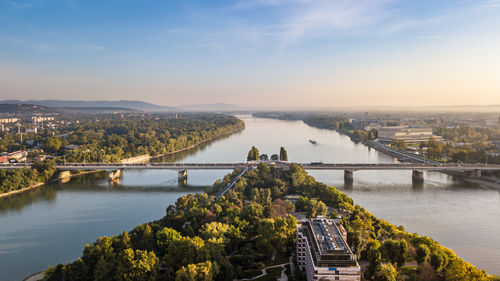 High angle view of bridge over river in city against sky