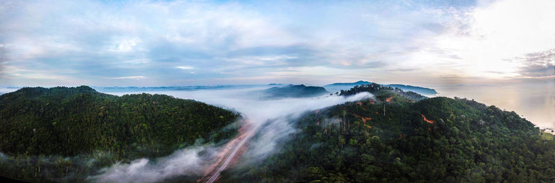 Scenic view of waterfall against sky