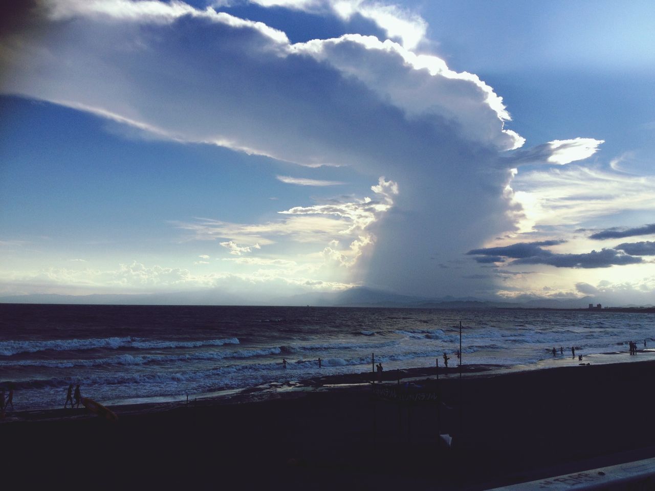 sea, horizon over water, sky, beach, water, scenics, shore, tranquil scene, tranquility, beauty in nature, cloud - sky, nature, cloud, sand, idyllic, incidental people, blue, cloudy, outdoors, day