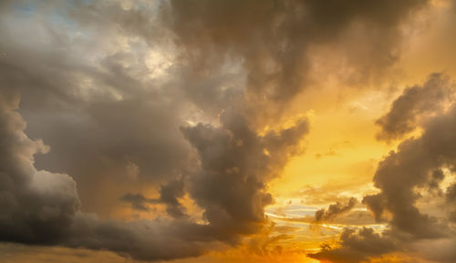 Low angle view of dramatic sky during sunset