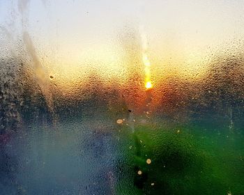 Full frame shot of wet glass window during rainy season