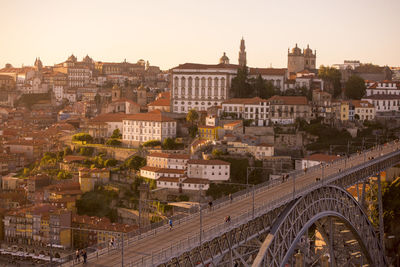 High angle view of dom luis i bridge against cityscape during sunset