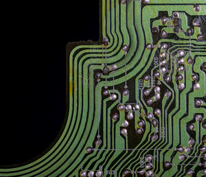 Close-up of metal grate against black background