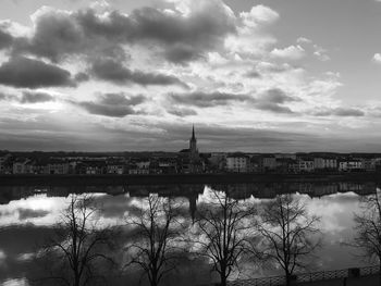 Reflection of buildings in river viewed from mâcon towards saint laurent, france