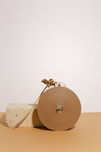 Close-up of wooden figurine against white background