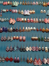 Multi colored decoration earrings hanging for sale at market stall