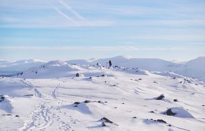 Scenic view of snowcapped mountains against sky