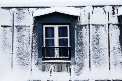 Close-up of house window during winter