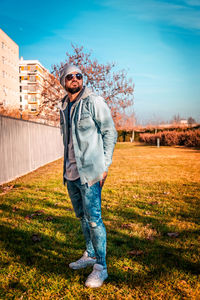 Portrait of man standing on field