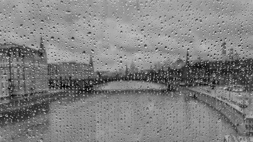 Full frame shot of wet glass window in rainy season