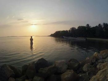 Scenic view of sea at sunset