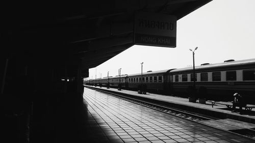 Train at railroad station against sky