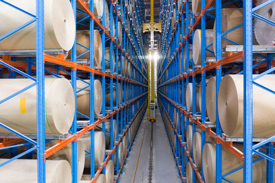 Low angle view of illuminated lighting equipment in factory