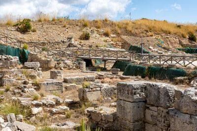 View of old ruins against cloudy sky