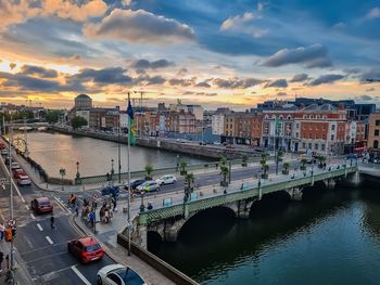 High angle view of bridge over river amidst buildings in city