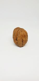 Close-up of bread against white background