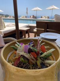 Close-up of vegetables in bowl on table at restaurant