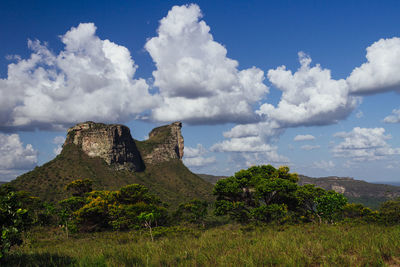 Scenic view of mountains against cloudy sky