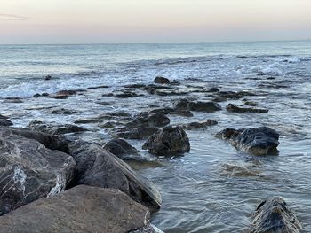 Scenic view of sea against sky during sunset