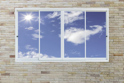 Low angle view of sky seen through window