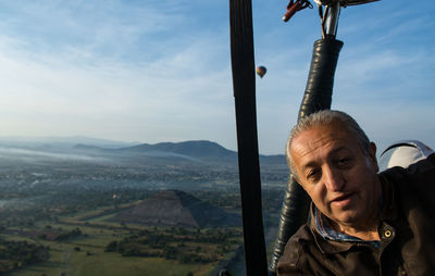 Man on mountain against sky