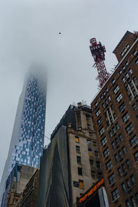 Low angle view of skyscrapers against sky