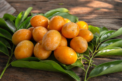 High angle view of oranges and fruits on table