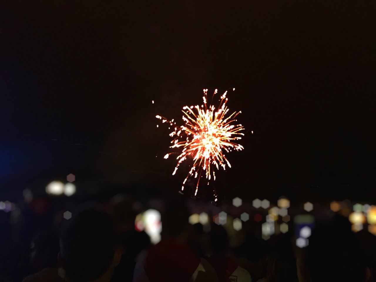 night, celebration, firework display, firework - man made object, event, arts culture and entertainment, illuminated, exploding, long exposure, real people, silhouette, outdoors, motion, firework, sparkler, lifestyles, sky, large group of people, men, clear sky, people