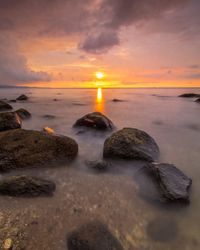 Scenic view of sea against sky during sunset