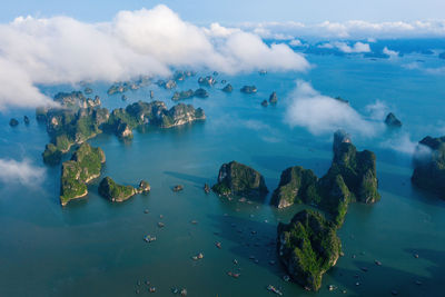 Aerial view of sea against cloudy sky