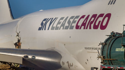 Close-up of airplane against sky