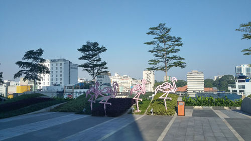 Cityscape against clear blue sky