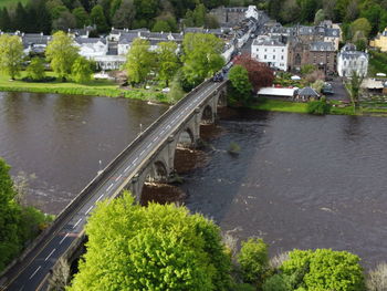 High angle view of bridge over river amidst buildings