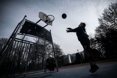 Low angle view of woman against sky