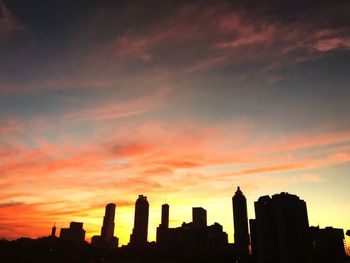 Silhouette of city at sunset