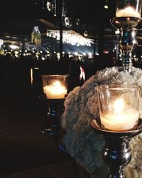 Lit tea light candles at night