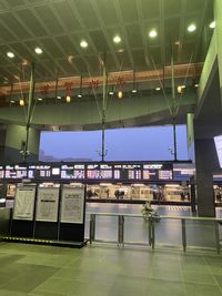 Low angle view of illuminated lighting equipment on airport