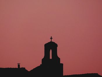 Silhouette church against sky during sunset