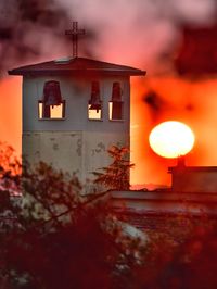 Close-up of illuminated building during sunset