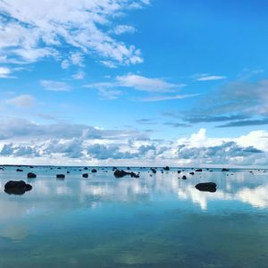 Scenic view of sea against blue sky