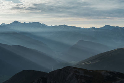 Scenic view of mountains against sky during sunset