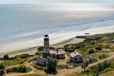 High angle view of buildings by sea