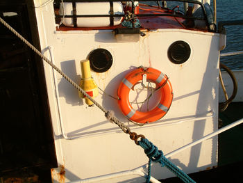 Low angle view of boat sailing on rope