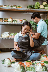 High angle view of mother and daughter sitting at restaurant