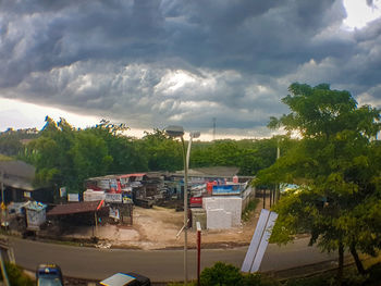 High angle view of trees and buildings against sky