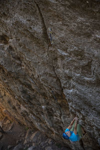 Rear view of woman on rock