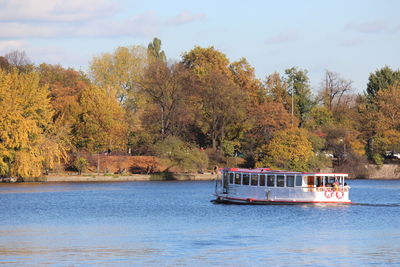 Scenic view of river against sky during autumn