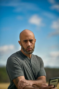 Portrait of man wearing sunglasses against sky