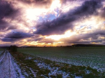 Scenic view of landscape against cloudy sky